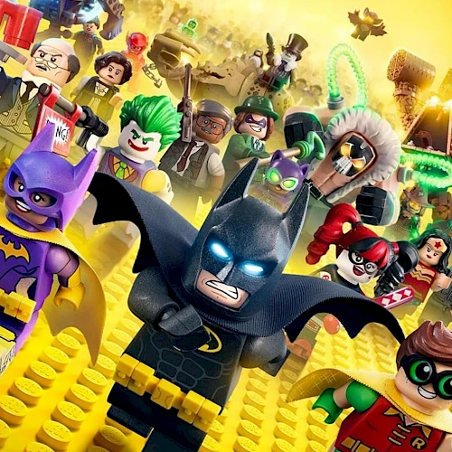 Batman leads a LEGO hero crew through a golden cityscape, with colorful allies and quirky villains in bright, playful action.