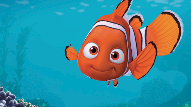 A cheerful orange clownfish glides over a vibrant coral reef, bright blue water all around, cartoon-like and friendly.