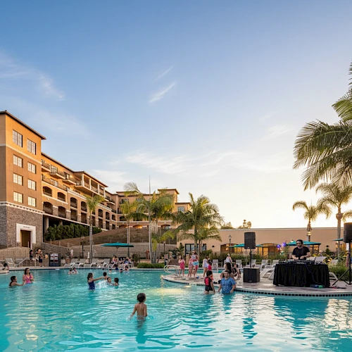 A sunny resort pool scene with people swimming and lounging, palm trees, and modern buildings in the background, bright and inviting.