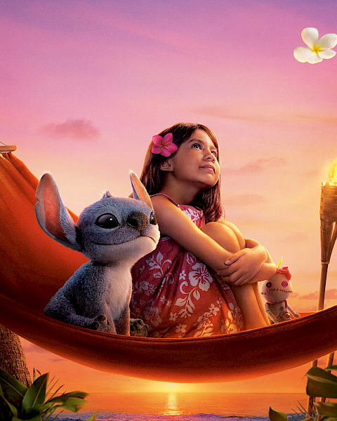 A girl lounges in a hammock with a cute blue creature, holding toy ice-cream cones as flowers float in a sunset sky.